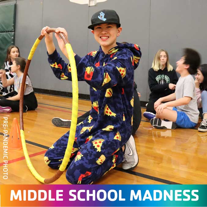 middle schooler plays with hula hoop in eugene ymca gym during middle school madness