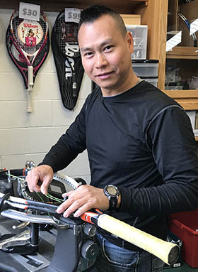 Aaron restringing rackets