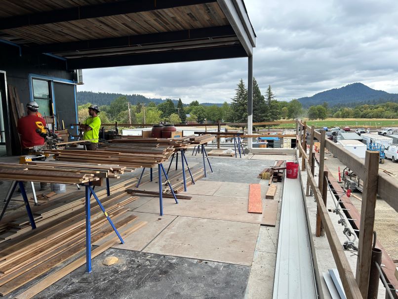 covered outdoor fitness terrace with a view of spencer's butte