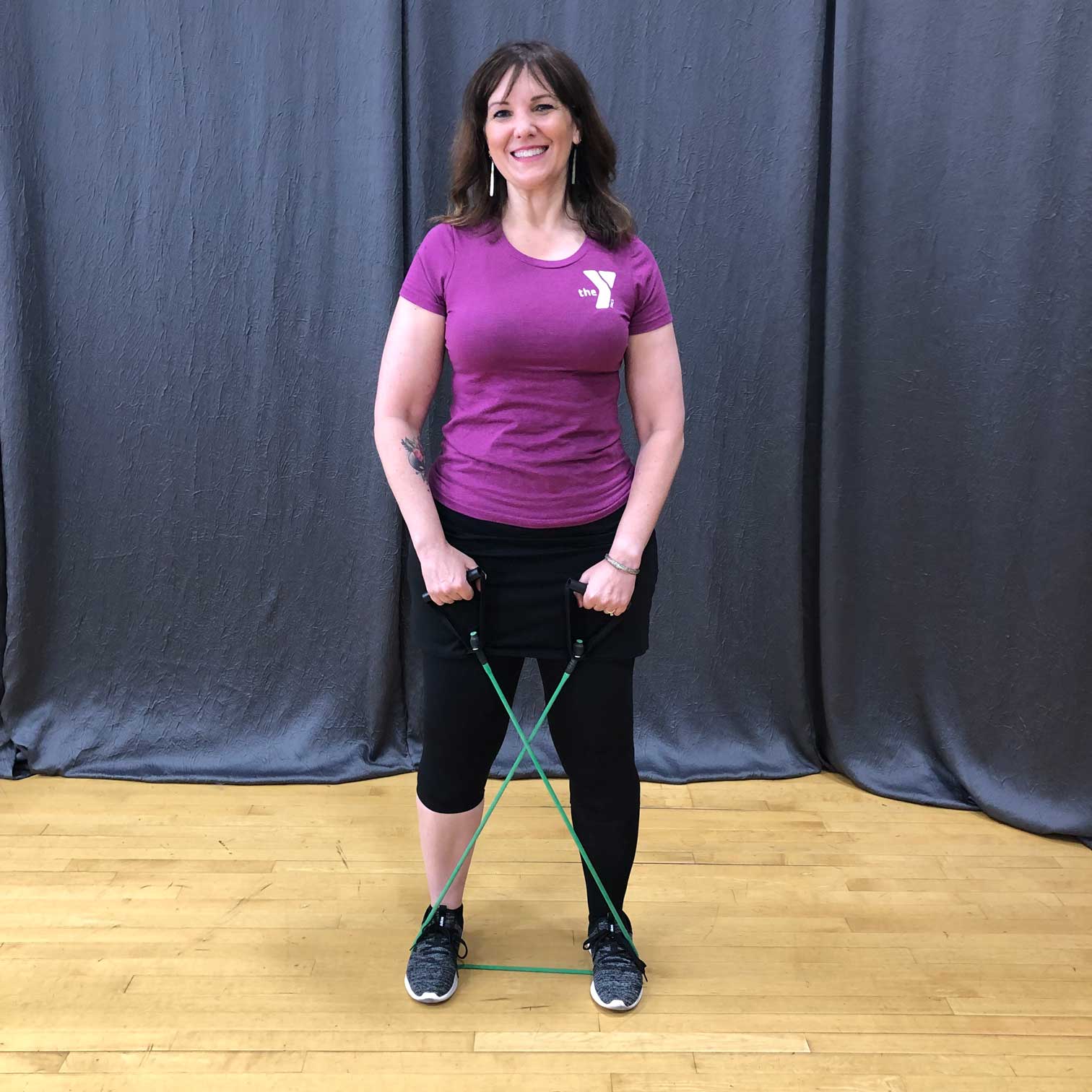 ymca member using resistance bands