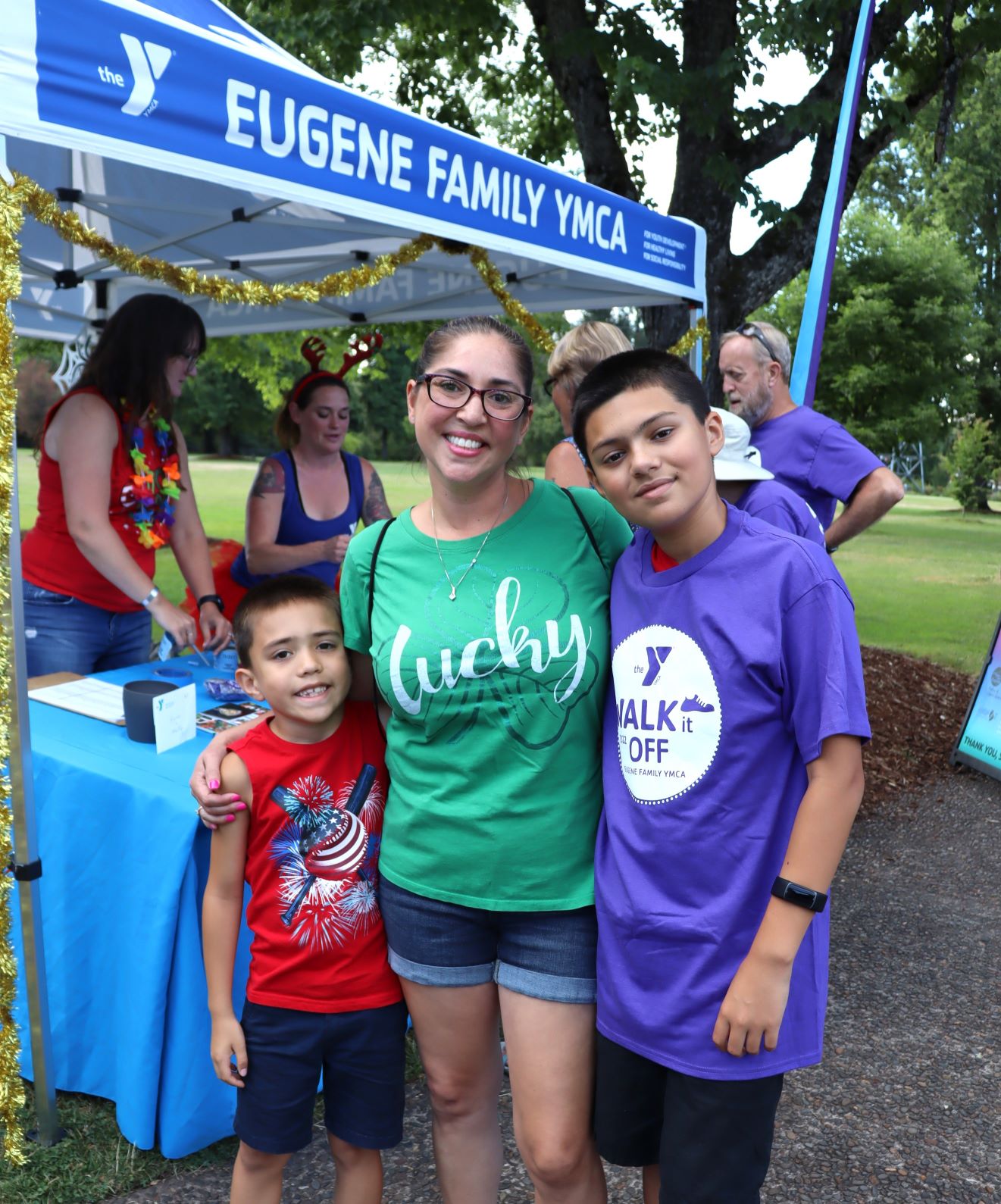 young mom and kids smile at walk it off with the y