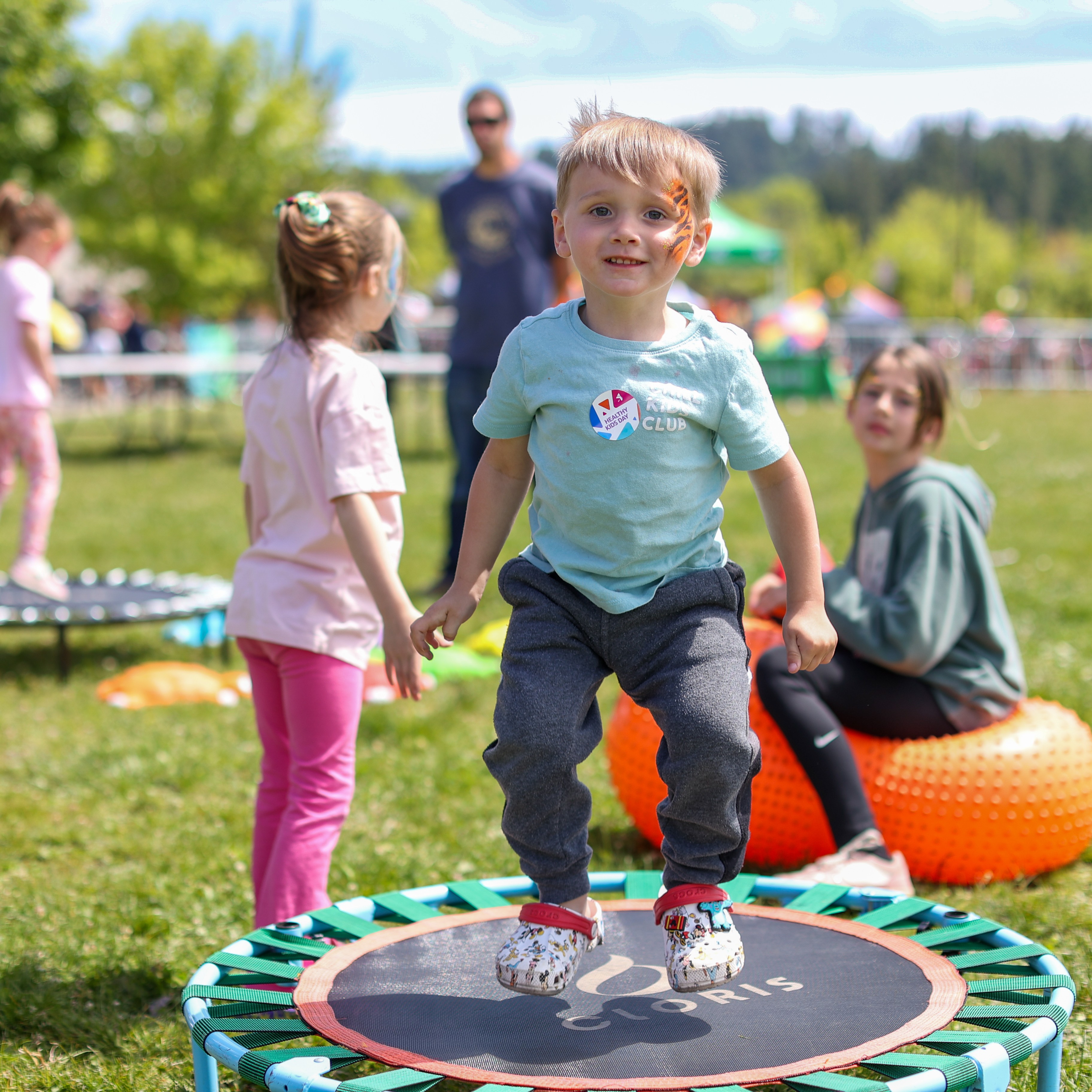 boy jumps on trampoline at Healthy Kids Day event at the Y
