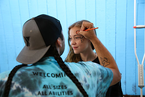 The Y's dig committee offering facepainting at Welcoming Festival
