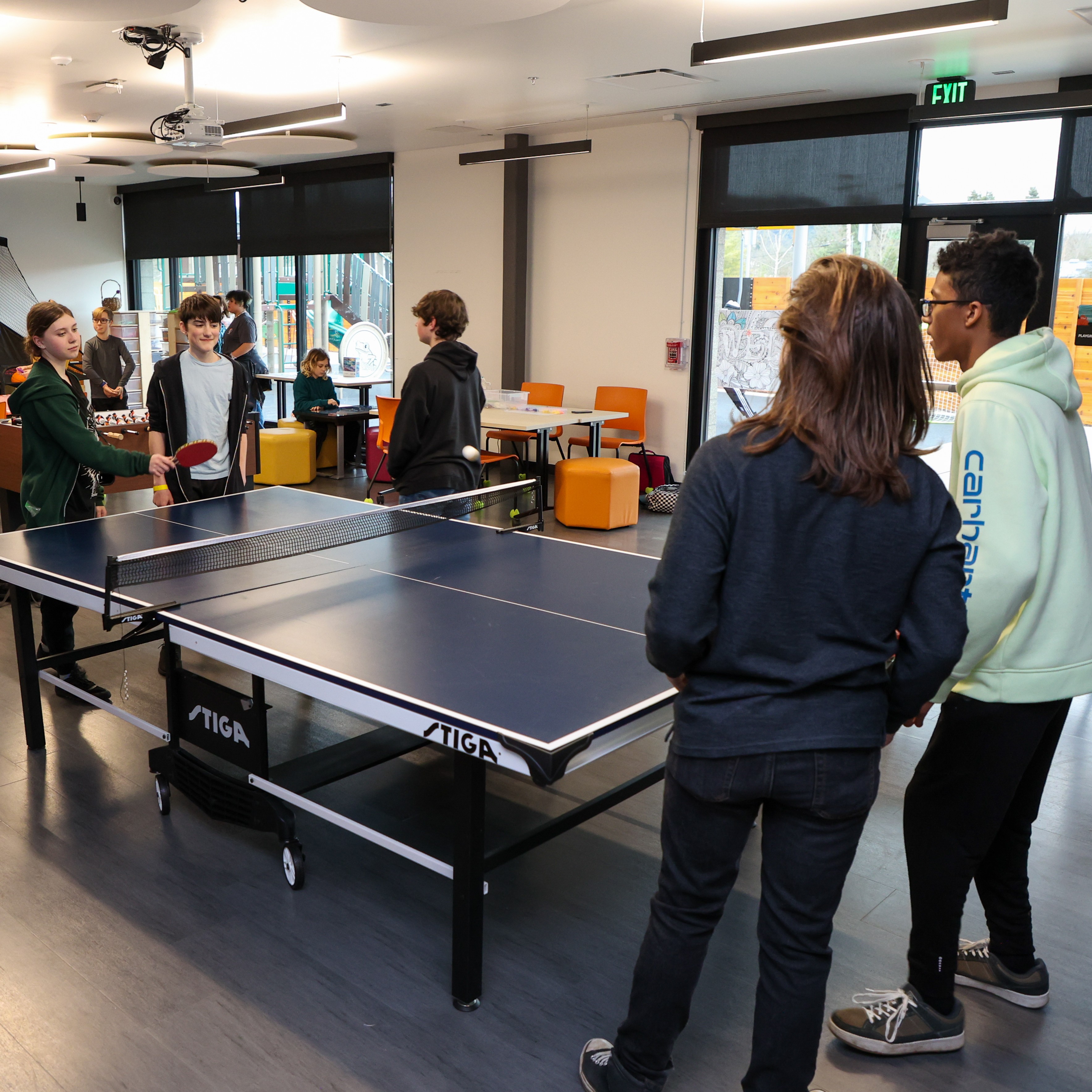 youth play ping pong in the Y's Creation Station