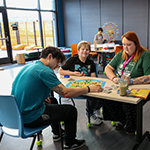 staff and youth enjoying the YMCA's Creation Station