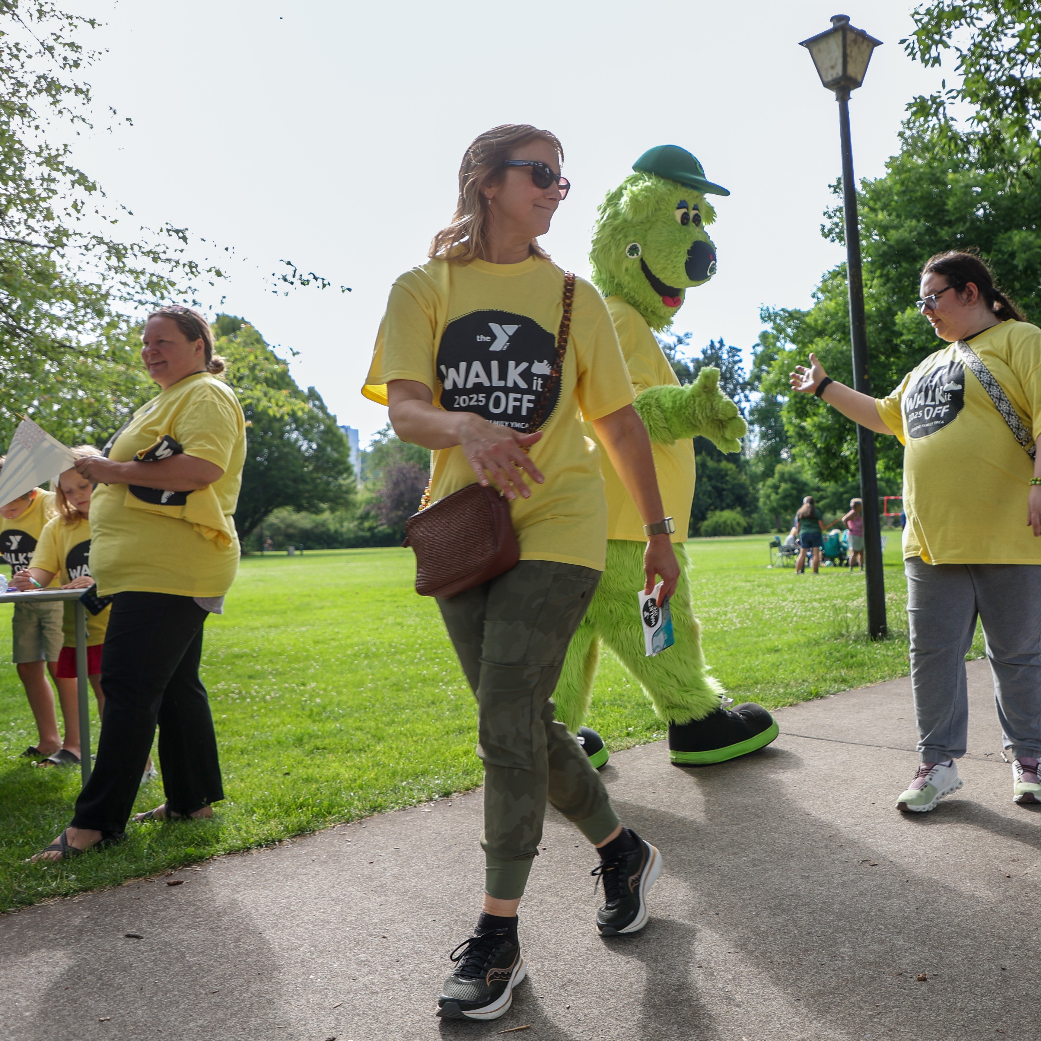 walkers join Sluggo the Eugene Emeralds mascot at a Walk It Off event