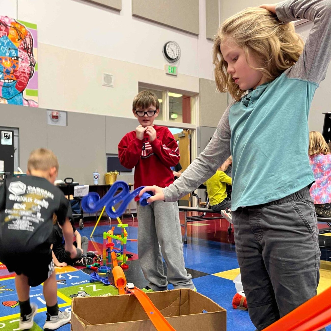 youth create a block tower