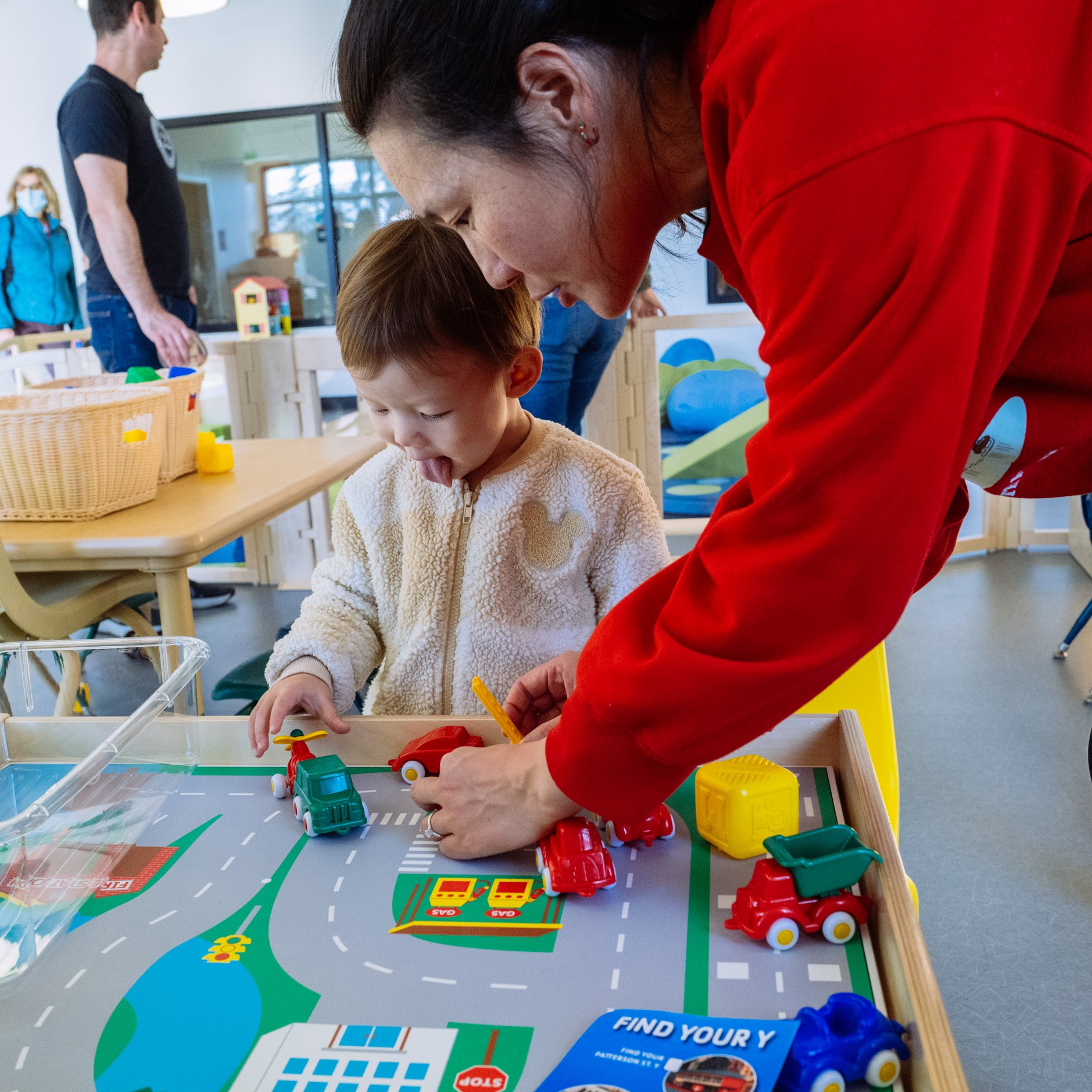 A toddler enjoying the Y's PlayZone drop-in child care space