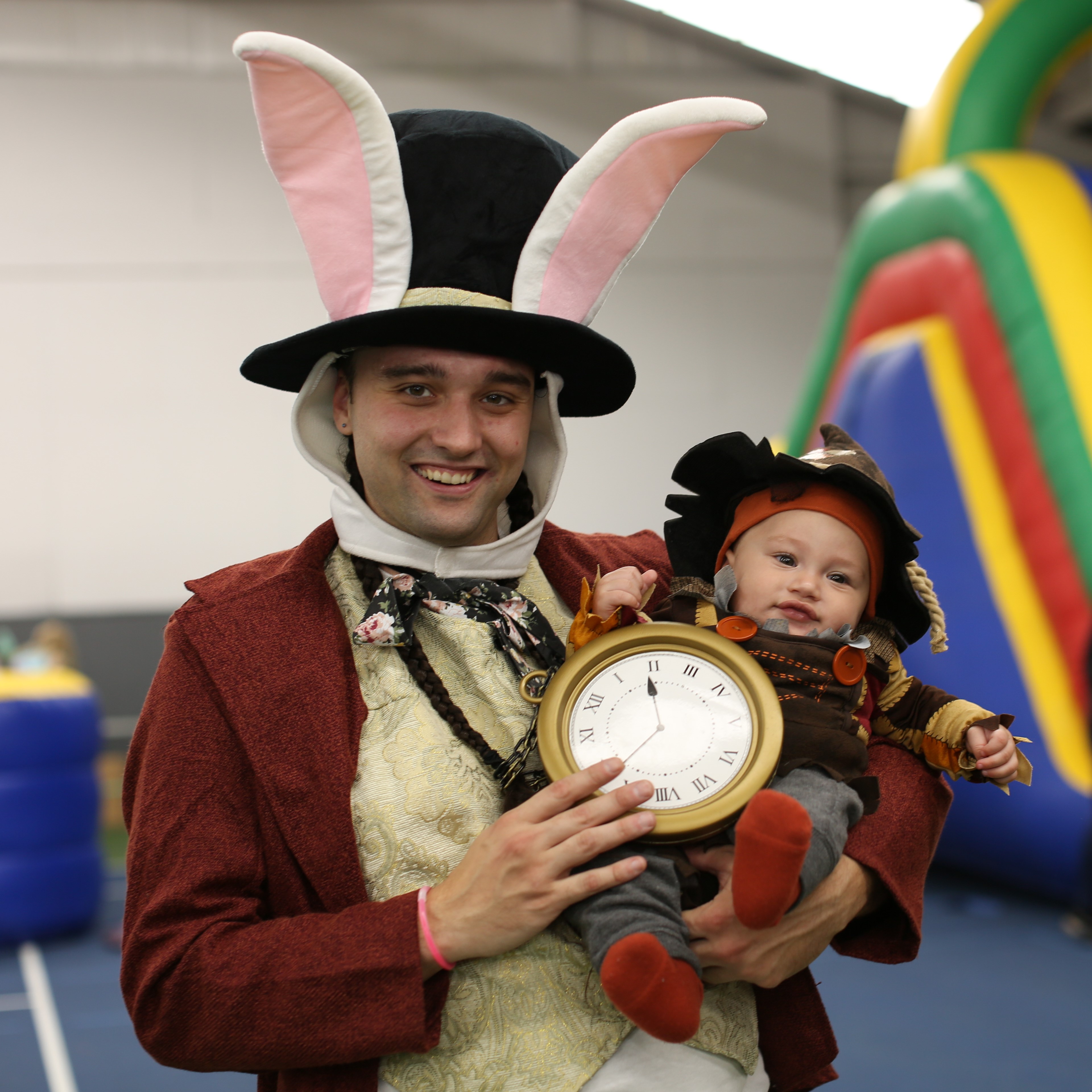 man and child dressed up smile at eugene ymca halloween party