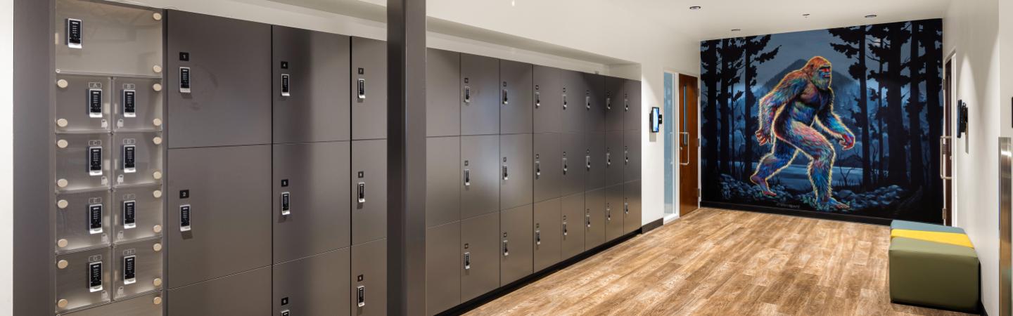 eugene family ymca lockers in the peacehealth wellness center gym and sasquatch mural by ila rose