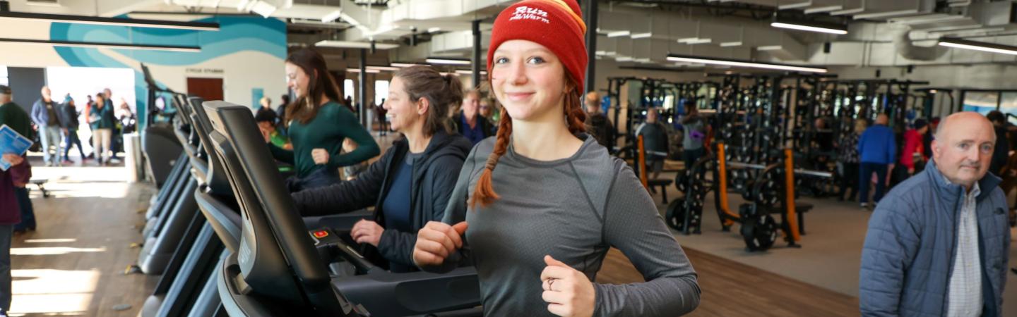 teen runs on treadmill with family