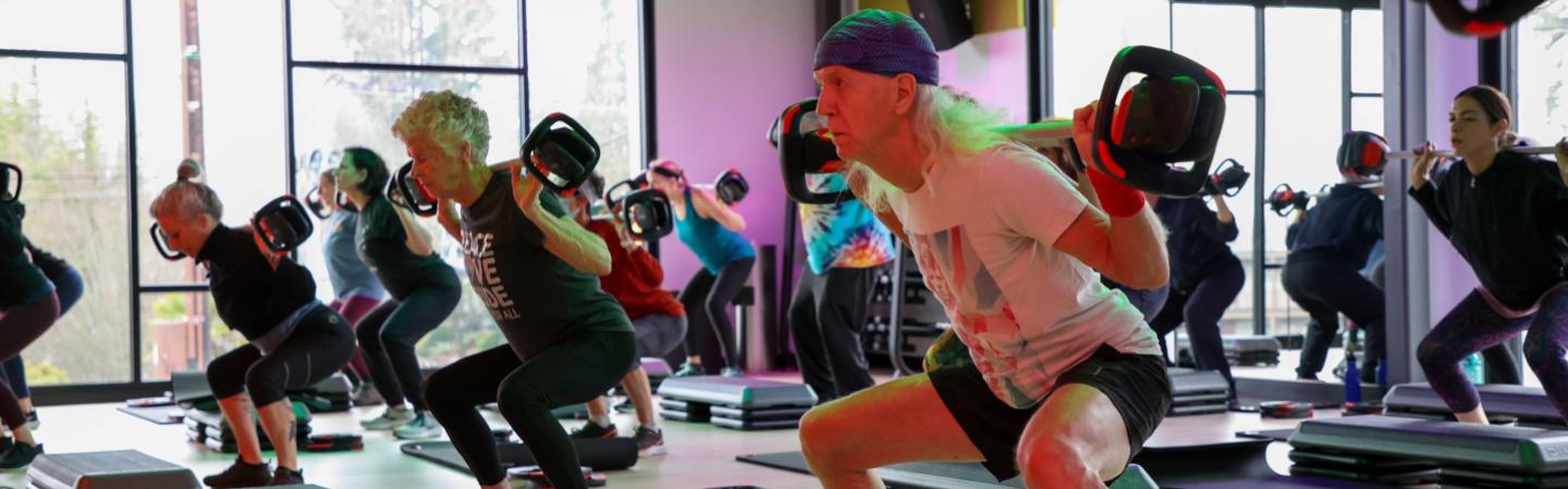 eugene ymca members work out in les mills body pump group fitness class
