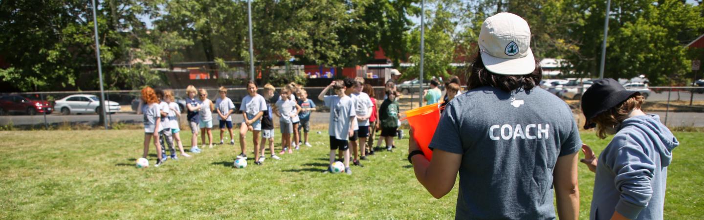 eugene ymca counselor coaching soccer for summer camp