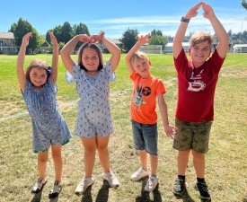 kids pose as YMCA during eugene ymca summer camp