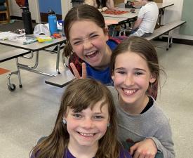 girls in eugene ymca afterschool care smile and laugh