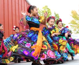 young girl performs traditional mexican dance at the eugene ymca welcoming festival
