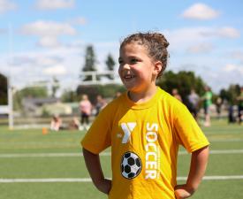 girl on socer field at a ymca clinic