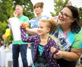 eugene ymca preschool teacher and student at the eugene ymca welcoming festival