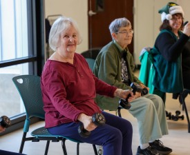 seniors smile in chair fitness