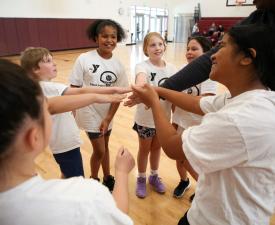ymca basketball team cheers together