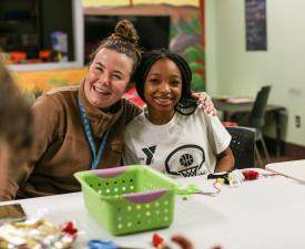 ymca staff and youth smile at middle school madness night at eugene ymca