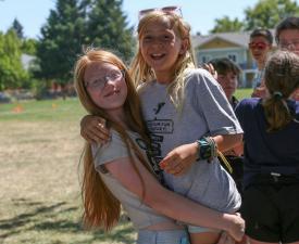 girls at eugene ymca summer camp smile together