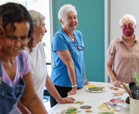 adults enjoying a cooking class at the YMCA