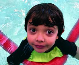 kid swimming in eugene ymca pool